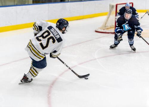 Trinity College mens Hockey player competing on ice